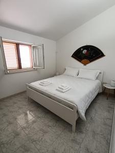 Postel nebo postele na pokoji v ubytování Villa Marina