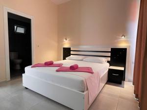Cama ou camas em um quarto em Marku Palace