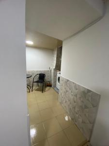 a room with a tile floor and a microwave at Дом в старом тбилиси in Tbilisi City