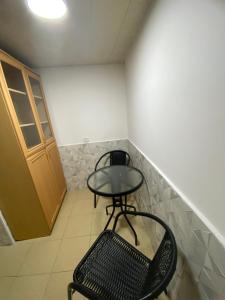 a small room with a table and two chairs at Дом в старом тбилиси in Tbilisi City