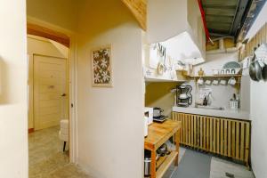 a kitchen with a sink and a counter at Pallet Homes - Petalsville in Iloilo City