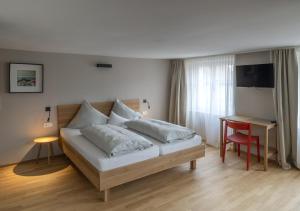 Letto o letti in una camera di Gasthof Löwen Tosters