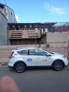 a white car parked on the side of a street at Dennis in Cluj-Napoca