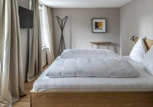 Letto o letti in una camera di Gasthof Löwen Tosters