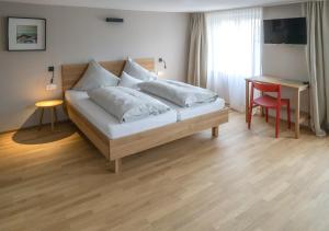Letto o letti in una camera di Gasthof Löwen Tosters