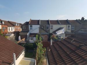a group of houses in a city with roofs at Portsmouth House near Centre 3 Bedrooms in Portsmouth