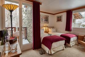Ένα ή περισσότερα κρεβάτια σε δωμάτιο στο Chalet Iona