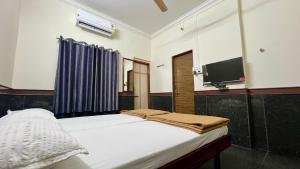 Fotografie z fotogalerie ubytování RajGaurav Lodging v destinaci Kolhápur