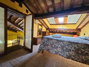 a bedroom with a large bed in a room at Agriturismo Ca Serrantonio - Ferri Appartamento Rossini in Urbania +21 photos