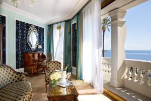 a living room with a view of the ocean at Hotel Le Negresco in Nice