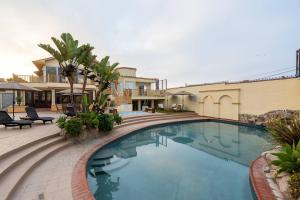 a swimming pool in front of a house at Ocean Home Sweet Home - Suite 4 in Rosarito +22 photos