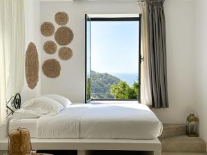 a bedroom with a bed and a large window at Villa Le Belvedere in Tangier