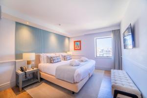 VIP Executive Suites do Marquês Hotel客房内的一张或多张床位
