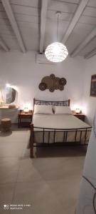 a bedroom with a large bed in a room at Avlidaki house in Exámbela