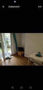 a picture of a room with a table and a window at Sky Appartment in Koblenz