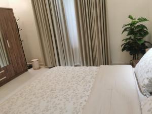 Postel nebo postele na pokoji v ubytování Camellia A