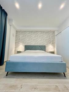 a bedroom with a large bed in a room at La Maison Blanche Otranto in Otranto +15 photos