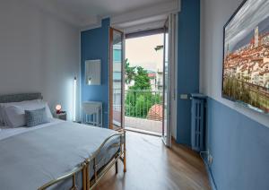 Ένα ή περισσότερα κρεβάτια σε δωμάτιο στο Matteotti Apartment by Mamo Florence