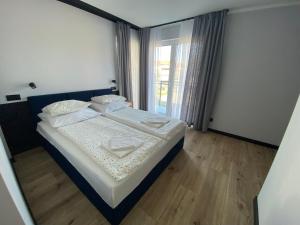 Postel nebo postele na pokoji v ubytování Baltic Stay