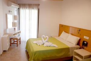 Postel nebo postele na pokoji v ubytování Valais Hotel