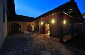 a house with a patio with a table and chairs at Nuga Residency by CityScape in Nugegoda