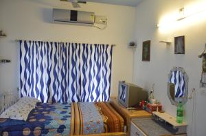 Postel nebo postele na pokoji v ubytování Aldos Ark Home Stay