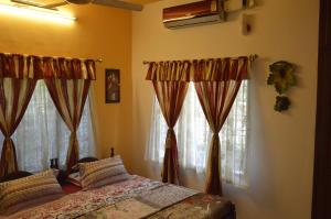 Postel nebo postele na pokoji v ubytování Aldos Ark Home Stay