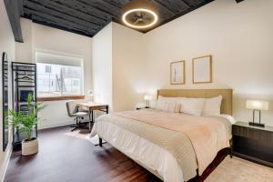 a bedroom with a large bed and a desk at Modern Harrisonburg Home - 2 Mi to JMU! in Harrisonburg +16 photos