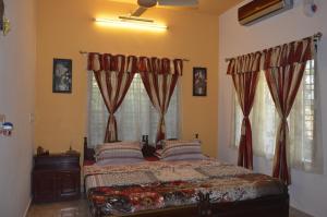 Postel nebo postele na pokoji v ubytování Aldos Ark Home Stay