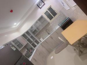 an overhead view of a kitchen with white shelves at Luxury apartment with balcony, City view in Jeddah