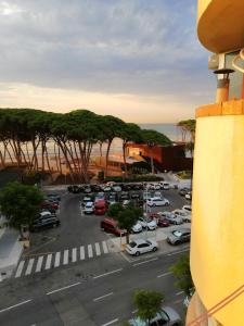 a view of a parking lot with cars parked at Estudio la Pineda playa in La Pineda +4 photos