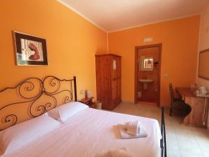 Postel nebo postele na pokoji v ubytování B&B Uliveto del Gargano