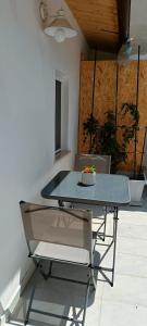 a glass table and chairs with a cake on it at Panorama City in Conversano +11 photos