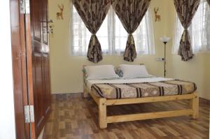 Postel nebo postele na pokoji v ubytování Aldos Ark Home Stay