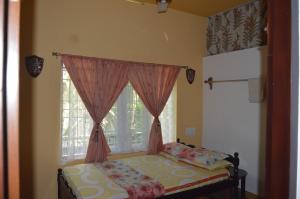 Postel nebo postele na pokoji v ubytování Aldos Ark Home Stay
