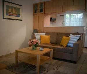A seating area at ILIOCHARI sea view apartments Oropos - Kalamos