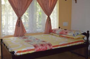 Postel nebo postele na pokoji v ubytování Aldos Ark Home Stay