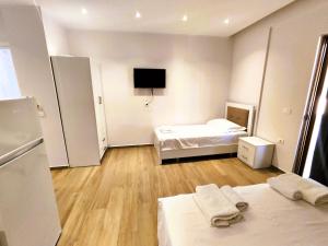Postel nebo postele na pokoji v ubytování Hola Rooms