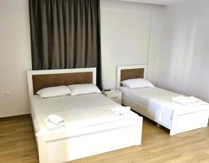 Postel nebo postele na pokoji v ubytování Hola Rooms