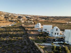 an aerial view of a village with white buildings at MelivOia - Sunset Jacuzzi Villas in Foinikiá
