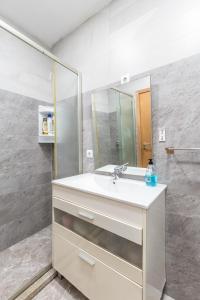 a bathroom with a sink and a mirror at NEW! Castel de Paiva in Raiva