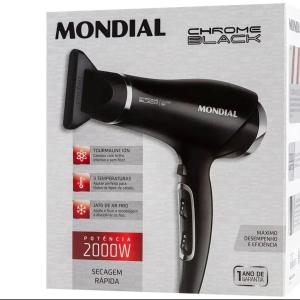 a black hair dryer on top of a magazine at Lar oliveiras, próximo cento, 500 metros de clube pinheiros in Pato Branco