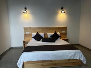 Postel nebo postele na pokoji v ubytování Senasuma Homestay