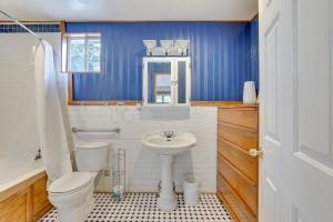 a bathroom with a toilet and a sink at Historic Boise Studio with Courtyard, Blocks to Dtwn in Boise +16 photos