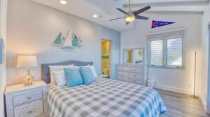 a bedroom with a bed and a ceiling fan at Catalina Island Getaway With 6 Seat Golf Cart Ac in Avalon +37 photos