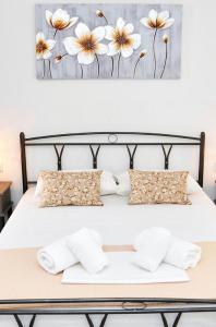 Postel nebo postele na pokoji v ubytování Louros rooms