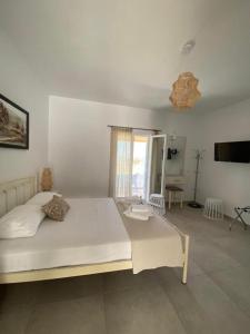Postel nebo postele na pokoji v ubytování Louros rooms