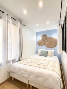 a bedroom with a large bed in a room at Villa Des Bégonias - PSG in Le Pré-Saint-Gervais +69 photos