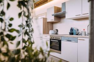 Kuchyň nebo kuchyňský kout v ubytování Cozy Bungalow inklusive free parking + 24 fotografií