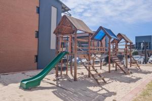 a playground with a slide and a green slide at Mkhonto's waterfall ridge in Midrand